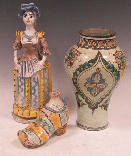 Lot 167 - A large Maiolica figural candlestick, a...