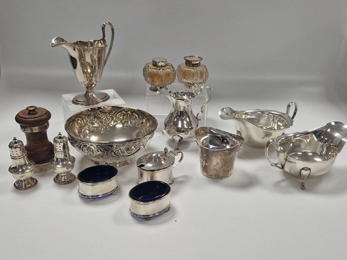 Lot 380 - A collection of silverware including cruets,...