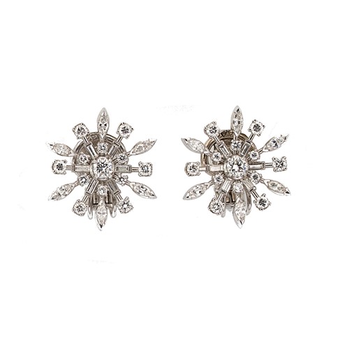 Lot 272 - A pair of snowflake style diamond set ear clips