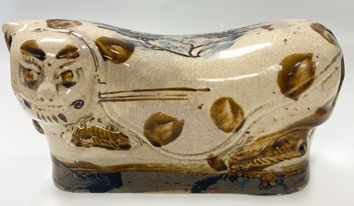 Lot 125 - A Cizhou style ceramic pillow modelled in the form of a leopard