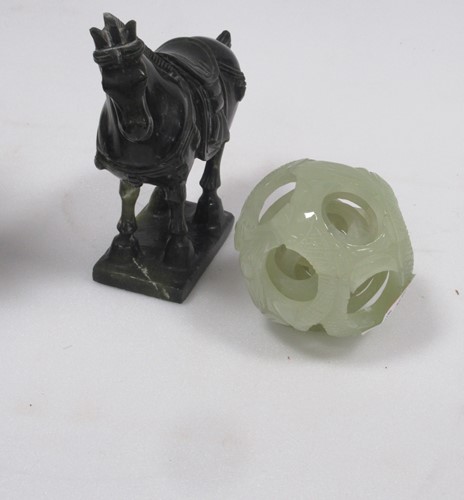 Lot 130 - A jade-type puzzle ball decorated with fish...