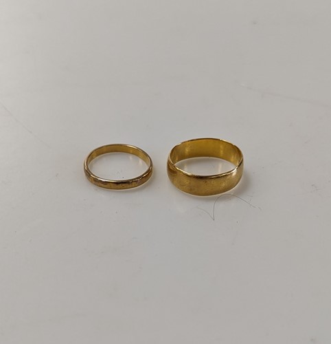 Lot 352 - Two hallmarked 22ct gold wedding bands, gross...