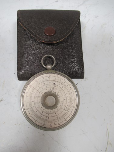 Lot 195 - A leather cased Halden Calculex circular slide...