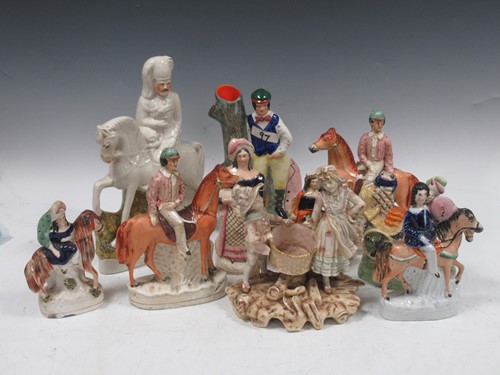Lot 180 - A collection of various Staffordshire figures...