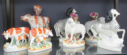 Lot 177 - Staffordshire figures. Pairs of zebras, sheep...