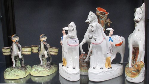 Lot 176 - Staffordshire figures. Three horse and pony...