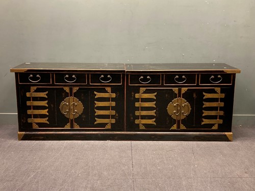 Lot 800 - A Chinese ebonised and gilt metal mounted low...