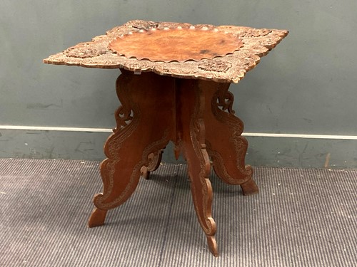 Lot 880 - A Chinese carved hardwood oocasional table,...