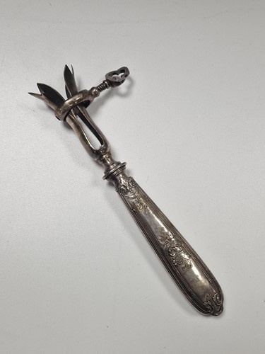 Lot 384 - A French metalwares silver handled ham clamp,...