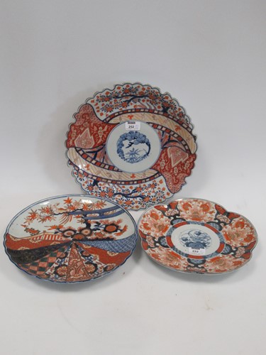 Lot 252 - Three Japanese Imari plates, one decorated...