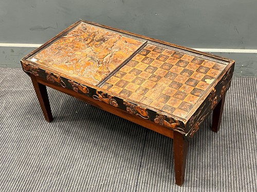 Lot 857 - A low games table with the lift off top with...