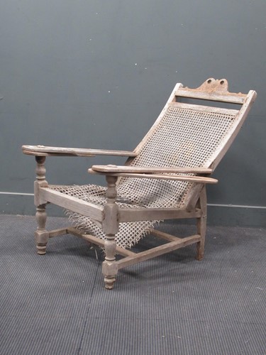 Lot 830 - A colonial tea planters chair