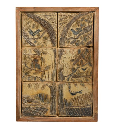 Lot 34 - A blue and brown glazed sgrafitto decorated tile plaque