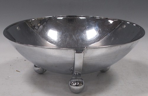 Lot 284 - A mid-century chromed fruit bowl on ball feet,...