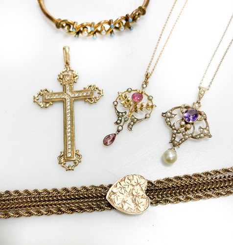 Lot 336 - A cross pendant set with cubic zirconia,...