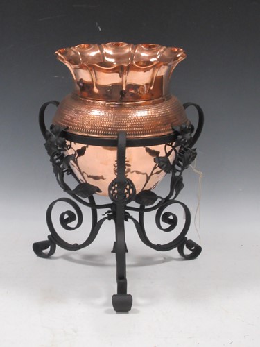 Lot 139 - An Arts & Crafts copper jardiniere on metal...