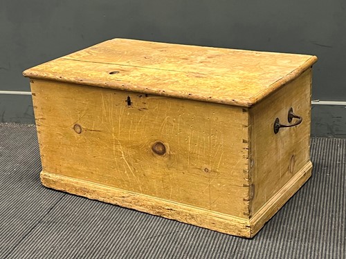 Lot 760 - A pine blanket chest with hinged lid and side...