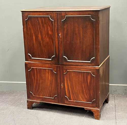 Lot 679 - A 19th century mahogany small linen cupboard...