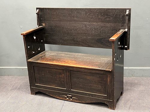 Lot 678 - An Arts and Crafts style "monk's bench" with...