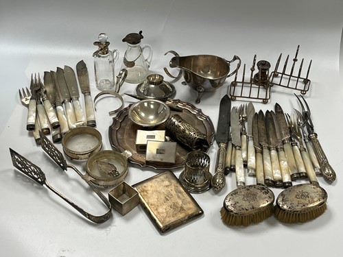 Lot 374 - A collection of silverware including sauce...