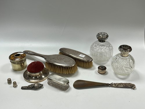 Lot 356 - Two silver topped glass perfume bottles, a...