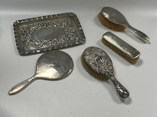 Lot 364 - A three-piece silver backed dressing table set,...