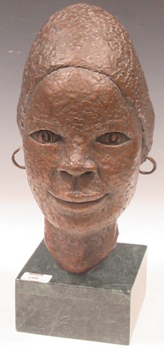 Lot 290 - A bronzed African bust on green marble stand....