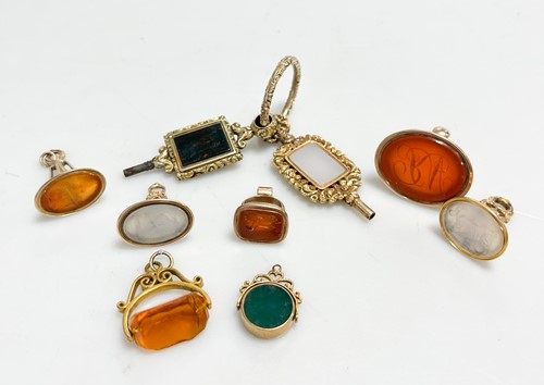 Lot 321 - Two early hardstone set pocket watch keys,...