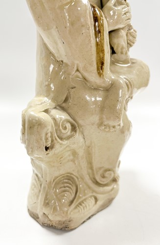 Lot 1 - A Chinese Cizhou figure of Guanyin with child, early 17th century