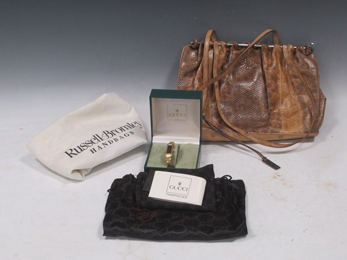 Lot 127 - A Gucci snakeskin bag; together with a Gucci...
