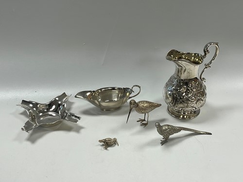 Lot 362 - A silver sauce boat, ashtray, cream jug, two...