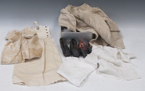Lot 166 - Textile collection of dolls and baby clothes,...