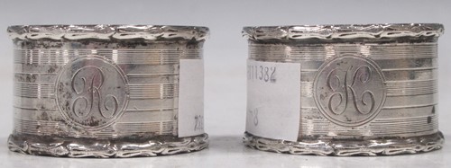 Lot 391 - Two Victorian sterling silver napkin rings
