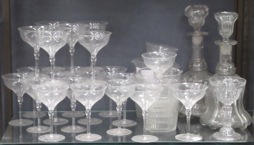 Lot 236 - Tenty-two champagne coupes with knopped stems;...