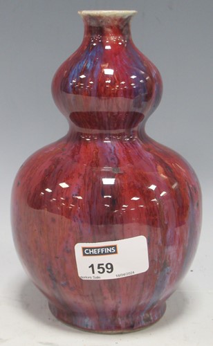 Lot 159 - A Chinese flambe glaze double gourd vase, 19cm...