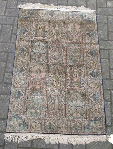 Lot 622 - A silk Turkish Hereke rug with a blue and...