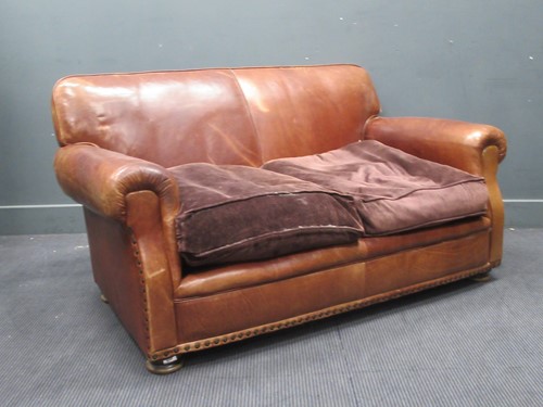 Lot 639 - A modern brown leather two seater sofa and...