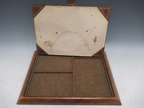 Lot 28 - An embossed leather desk blotter; book stand:...