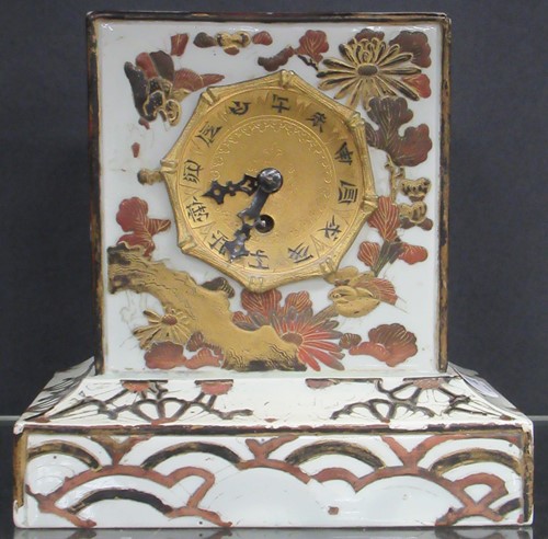 Lot 133 - A Japanese pottery mantle clock 19cm high