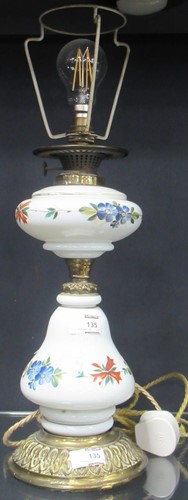 Lot 135 - A Victorian painted white opaline table lamp...