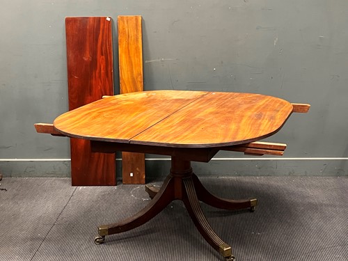 Lot 494 - A 19th century mahogany tilt top dining table...