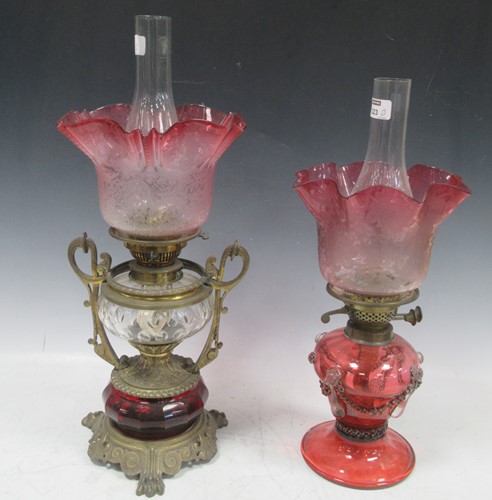 Lot 223 - Two Victorian Cranberry glass and brass oil lamps