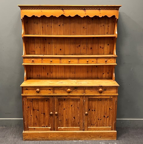 Lot 498 - A 20th century pine dresser with shelf back,...