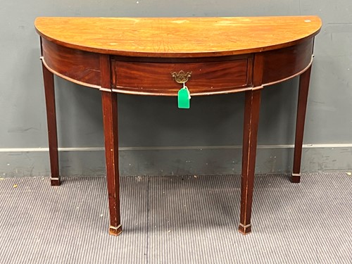 Lot 611 - A George III mahogany demilune side table...