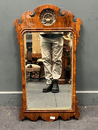 Lot 680 - A 19th century walnut fretwork wall mirror...