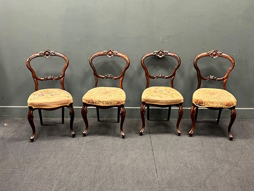 Lot 597 - A set of four Victorian rosewood balloon back...