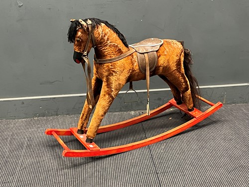 Lot 514 - A small plush covered rocking horse 77 x 106 x...