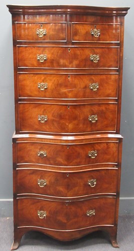 Lot 606 - A reproduction mahogany serpentine fronted...