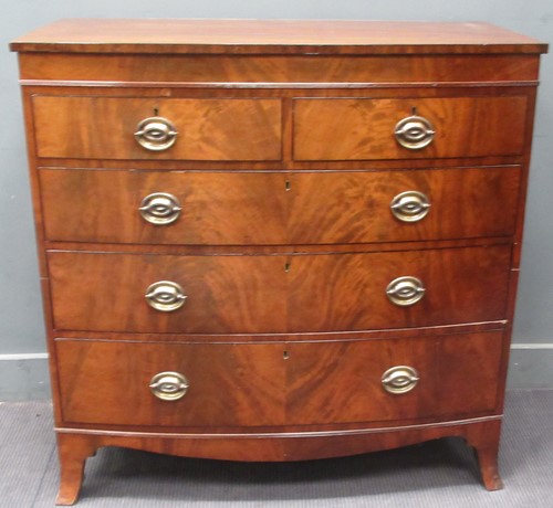 Lot 631 - A Regency mahogany bow front chest of drawers...