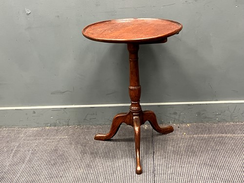 Lot 571 - A George III oak tripod table. 71cm x 51cm